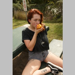 Redhead-Kelsey-Berneray-Tattoo-Eating-Outside-1.jpg