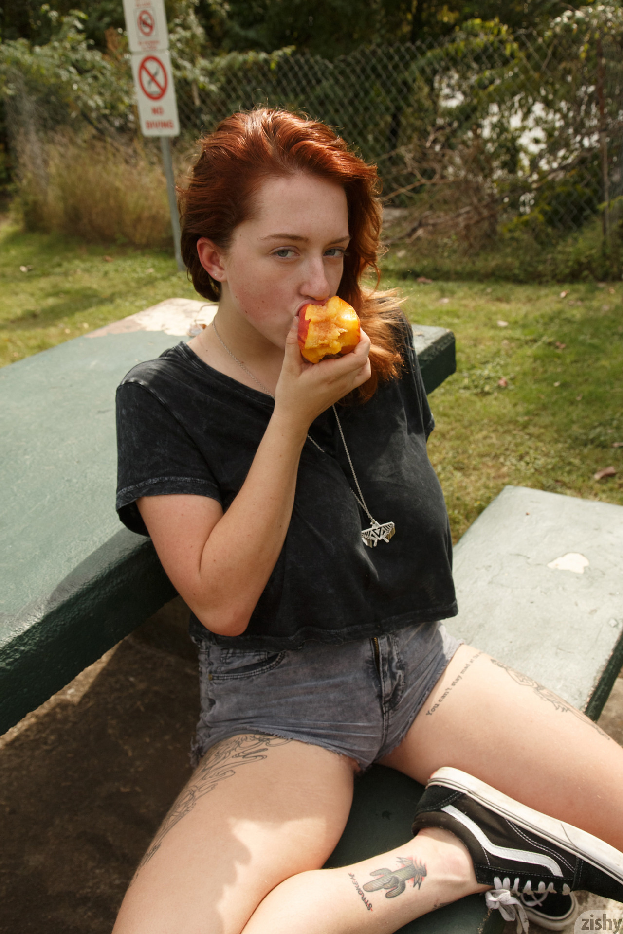 Redhead-Kelsey-Berneray-Tattoo-Eating-Outside-1.jpg